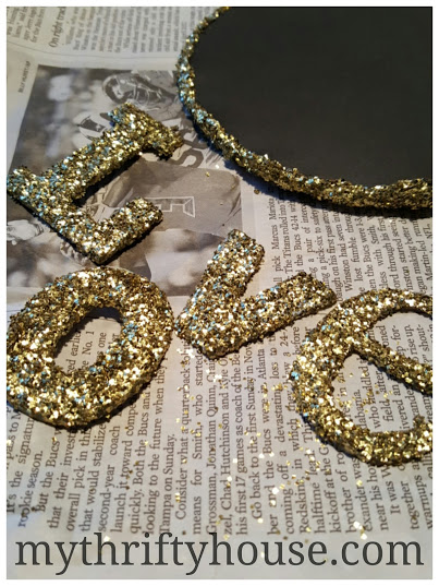 Glittered letters for vintage book page wreath