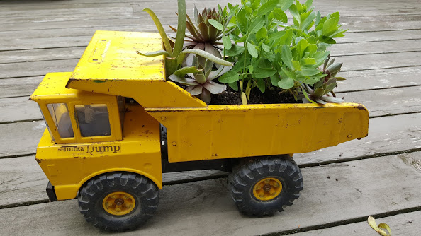 Using a Tonka truck as a unique flower planter