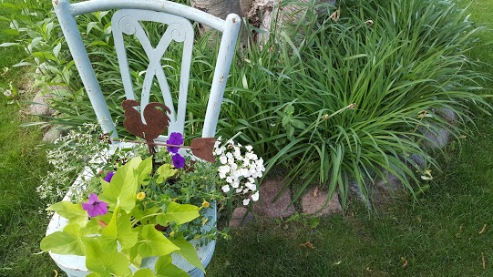 Unique flower planter box made from a flea market chair