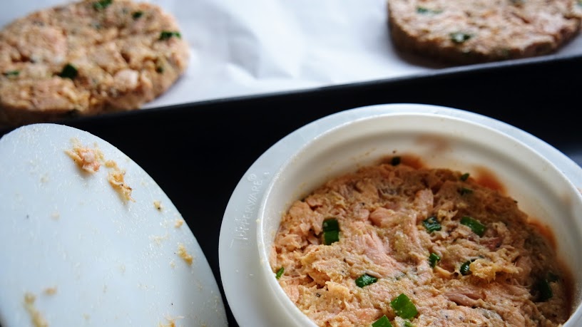 Baking Whole30 Key Lime Salmon Patties on parchment paper