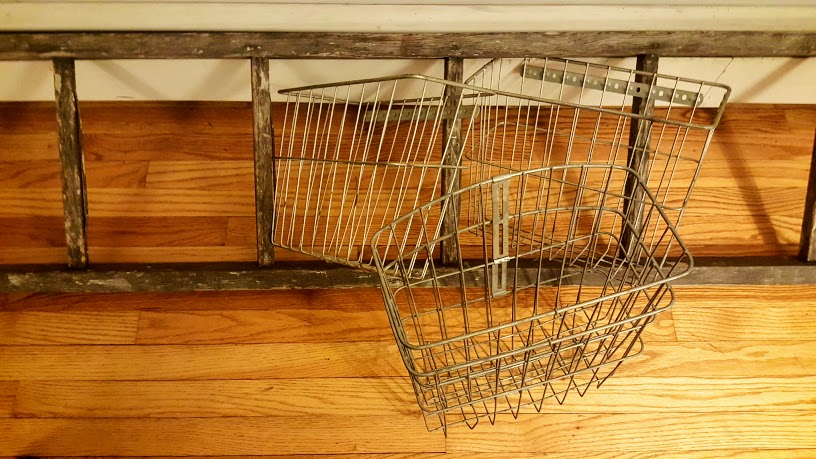 Before pic of rustic ladder and vintage wire baskets
