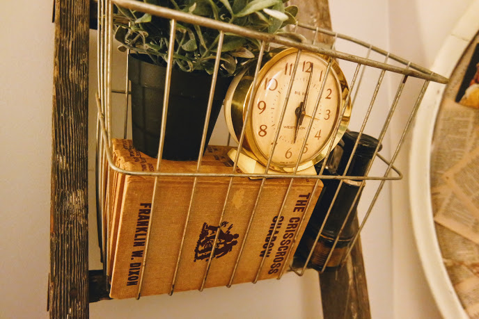 Rustic ladder with vintage wire baskets and vintage clock