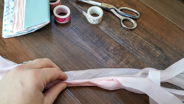 Twisting tissue paper tassel garland