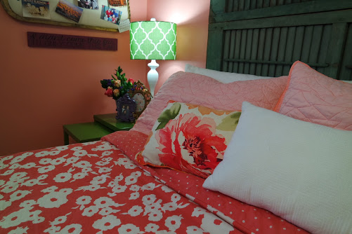 teenage girl bedroom with shutter headboard and pillows
