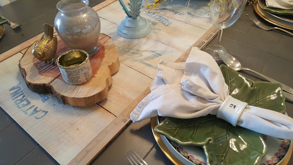 simple and elegant table setting with cloth napkins and mismatched dishes