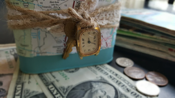 Travel fund coin bank decorated with a vintage map, twine, lace and trinkets
