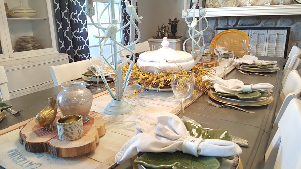 elegant and simple table setting with metal bird candle holders