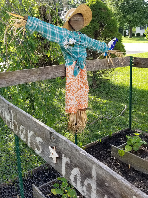 Cute garden scarecrow upcycled from ugly scarecrow